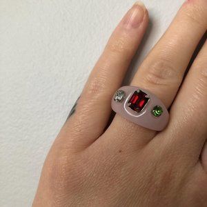 Light pink resin ring with clear red and green CZ stones